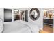 The main bedroom with neutral decor, recessed lighting, and en suite bathroom at 3617 Shoshone St, Denver, CO 80211
