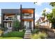 Striking modern two-story home with a brick facade, wood accents, and a well-manicured front yard at 3617 Shoshone St, Denver, CO 80211