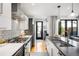 Modern kitchen with stainless steel appliances, sleek countertops, and a view to the outdoor patio at 3617 Shoshone St, Denver, CO 80211