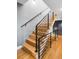 Modern staircase with wood treads and sleek metal railings at 3617 Shoshone St, Denver, CO 80211