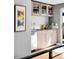 Convenient wet bar with modern appliances and ample cabinet space at 3617 Shoshone St, Denver, CO 80211