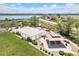 Aerial view showcasing a park, basketball court, picnic pavilion, and nearby walking paths by a lake at 9530 E 113Th Ave, Commerce City, CO 80640