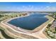 Beautiful aerial view of neighborhood lake and green space on a bright sunny day at 9530 E 113Th Ave, Commerce City, CO 80640