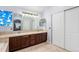Bathroom with double vanity, tile flooring, and a blue stained glass window at 9530 E 113Th Ave, Commerce City, CO 80640