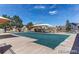 Community pool area featuring a covered pool, seating, shade structures, and nearby residential buildings at 9530 E 113Th Ave, Commerce City, CO 80640