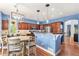 Inviting kitchen with bar seating, stylish pendant lighting, and modern appliances for a seamless cooking experience at 9530 E 113Th Ave, Commerce City, CO 80640