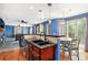 Open concept kitchen with a breakfast bar, pendant lighting, and adjacent dining area at 9530 E 113Th Ave, Commerce City, CO 80640