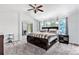 Spacious main bedroom features a large bed, windows, and neutral decor at 9530 E 113Th Ave, Commerce City, CO 80640