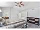 Cozy main bedroom with a plush bed, dresser, and ample closet space at 9530 E 113Th Ave, Commerce City, CO 80640