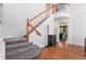 Grand staircase leads to the upper level, showcasing architectural details at 9530 E 113Th Ave, Commerce City, CO 80640