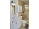 Bathroom with vanity, cabinet storage, toilet, and glass enclosed shower at 10966 Josephine St, Northglenn, CO 80233