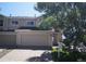 Charming townhome with a two-car garage, mature tree, and well-maintained landscaping at 10966 Josephine St, Northglenn, CO 80233