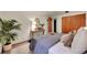 Cozy bedroom featuring stylish decor, including an area rug, lamps, and wooden accents at 755 S Clay St, Denver, CO 80219