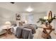 Comfortable bedroom with a plush bed, side tables, lamps, and decorative plant accents at 755 S Clay St, Denver, CO 80219