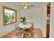 Bright dining area with a modern table set, natural light, and hardwood floors for a cozy meal setting at 755 S Clay St, Denver, CO 80219