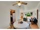 Inviting dining room with a white table, hardwood floors, and an open view of the living space at 755 S Clay St, Denver, CO 80219