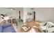 Comfortable living area showcasing hardwood floors, a view of the dining space, and a modern decorative touch at 755 S Clay St, Denver, CO 80219