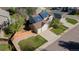 Overhead view showcasing a home with solar panels, two-car garage, and a spacious, green yard at 9525 W Victoria Dr, Littleton, CO 80128