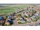 Aerial view of the neighborhood highlighting the home's location near green space and rolling hills at 9525 W Victoria Dr, Littleton, CO 80128