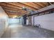 Unfinished basement with exposed ceiling, concrete floor, and utility connections ready for customization at 9525 W Victoria Dr, Littleton, CO 80128