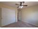 Bedroom with a ceiling fan and a closet at 9525 W Victoria Dr, Littleton, CO 80128