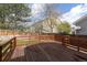 Large wooden deck perfect for outdoor entertaining with railing overlooking the backyard at 9525 W Victoria Dr, Littleton, CO 80128
