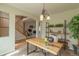 Bright home office space with large desk and bookshelf at 9525 W Victoria Dr, Littleton, CO 80128