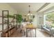 Bright home office space with neutral decor, large desk, and storage at 9525 W Victoria Dr, Littleton, CO 80128
