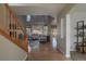 Bright living room with soaring ceilings, large windows, and hardwood floors at 9525 W Victoria Dr, Littleton, CO 80128
