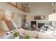 Inviting living room with a fireplace, a loft, and comfortable seating at 9525 W Victoria Dr, Littleton, CO 80128