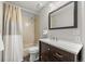 Inviting bathroom with a shower/tub combination, a classic vanity, and neutral color scheme at 12672 Rancho Ct, Conifer, CO 80433