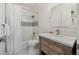 Classic bathroom with a shower/tub combo, a modern vanity, and clean white accents at 12672 Rancho Ct, Conifer, CO 80433