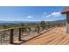 Enjoy scenic mountain views from this home's spacious deck, perfect for relaxing and entertaining guests outdoors at 12672 Rancho Ct, Conifer, CO 80433