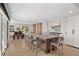 Spacious kitchen with light wood floors, large island with seating, and modern appliances at 12672 Rancho Ct, Conifer, CO 80433