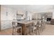 Spacious kitchen with large island, bar stool seating, and modern stainless steel appliances at 12672 Rancho Ct, Conifer, CO 80433