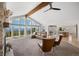 Open-concept living room with vaulted ceilings, mountain views, and seamless flow to the dining area and kitchen at 12672 Rancho Ct, Conifer, CO 80433