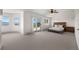 Open main bedroom with vaulted ceilings, large windows, and access to a private deck at 12672 Rancho Ct, Conifer, CO 80433