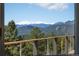 Beautiful mountain view from the deck, showcasing snow-capped peaks and lush evergreen forests at 12672 Rancho Ct, Conifer, CO 80433
