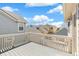 Balcony view showing neighborhood rooftops and a sunny sky with white clouds at 11367 S Blackthorn Ct, Parker, CO 80134