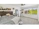 Comfortable bedroom featuring a large window for natural light and a ceiling fan at 11367 S Blackthorn Ct, Parker, CO 80134