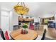 Dining space with chandelier open to kitchen; perfect for gatherings and everyday living at 11367 S Blackthorn Ct, Parker, CO 80134