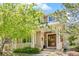 Charming two-story home with a welcoming front porch and beautiful landscaping at 11367 S Blackthorn Ct, Parker, CO 80134