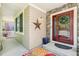 Inviting front porch with brick accents, double-door entrance, and colorful welcome rug at 11367 S Blackthorn Ct, Parker, CO 80134