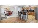 Open kitchen featuring an island with barstool seating and stainless steel appliances at 11367 S Blackthorn Ct, Parker, CO 80134