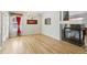 Spacious living room featuring hardwood floors, a fireplace, and ample natural light at 11367 S Blackthorn Ct, Parker, CO 80134