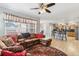 Open-concept living room that flows into the kitchen with hardwood floors at 11367 S Blackthorn Ct, Parker, CO 80134