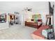 Spacious main bedroom with a sitting area, exercise equipment, and a large sleigh bed at 11367 S Blackthorn Ct, Parker, CO 80134