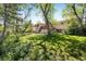 The home features a spacious backyard with lush greenery and a wooden deck, perfect for outdoor activities at 1270 Berea Dr, Boulder, CO 80305