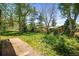 Expansive backyard with lush greenery and a charming brick patio for outdoor living and entertaining at 1270 Berea Dr, Boulder, CO 80305