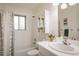 Well-lit bathroom with a shower-tub combo, sleek vanity, and medicine cabinet at 1270 Berea Dr, Boulder, CO 80305